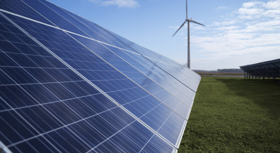 Solar panel farm with a windmill