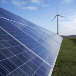 Solar panel farm with a windmill